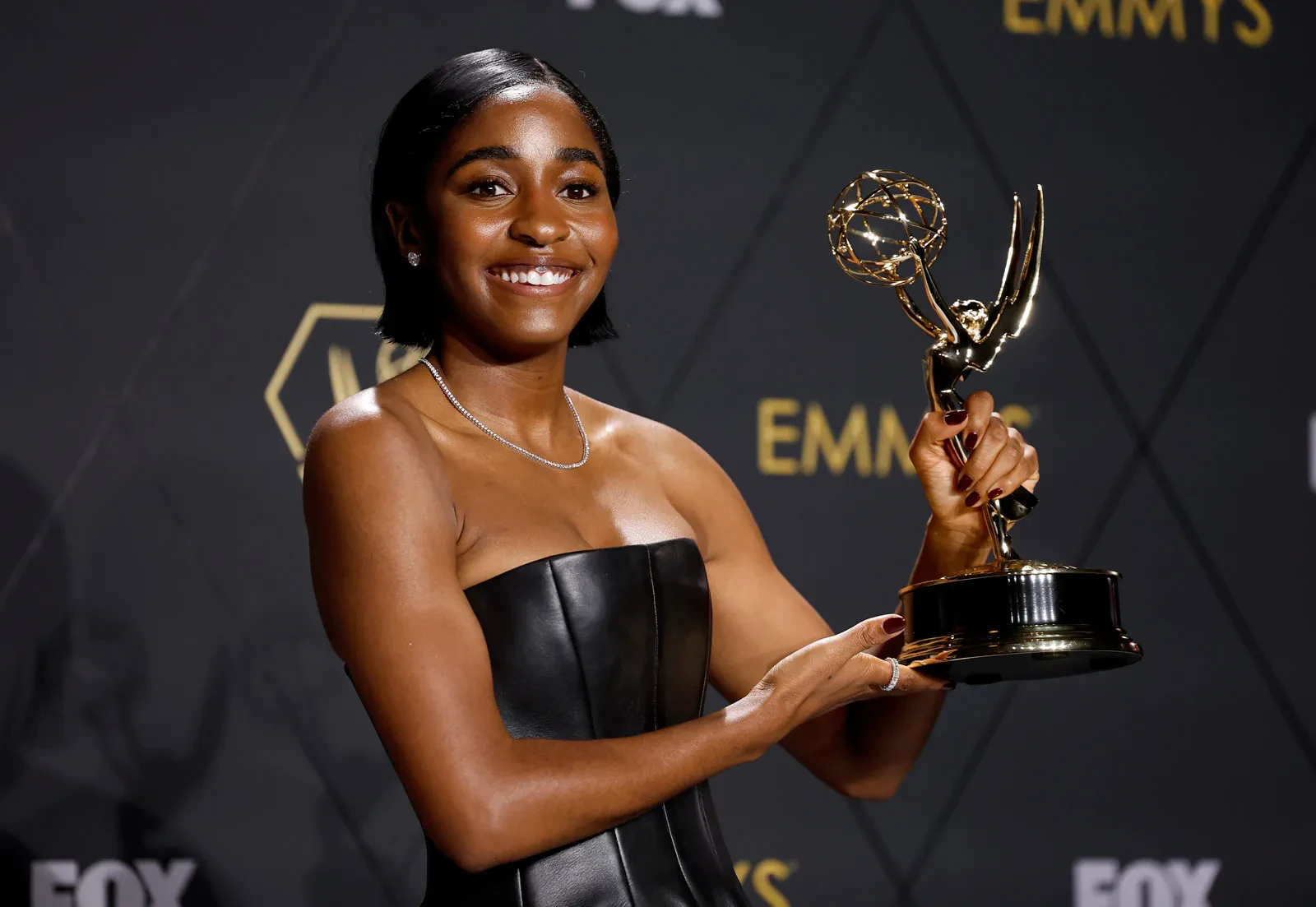 Editorial gallery of Ayo Edebiri styled in soft spring wardrobes featuring peach, mint, and buttery neutrals, highlighting melon, sage, muted coral, warm ivory, and powder blue.