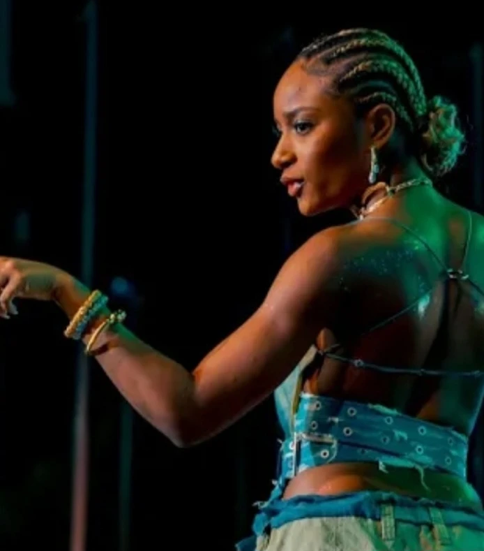 Ayra Starr wearing muted autumn ensembles with velvety textures and gentle warmth, showcasing desert rose, sage green, oatmeal, copper brown, and soft teal from the Soft Autumn palette.