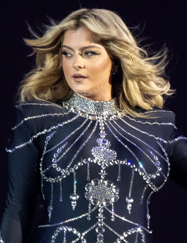 Bebe Rexha wearing glowing pastel outfits with warm undertones, showcasing peach sorbet, seafoam, buttercream, leafy green, and rose beige from the Soft Spring palette.