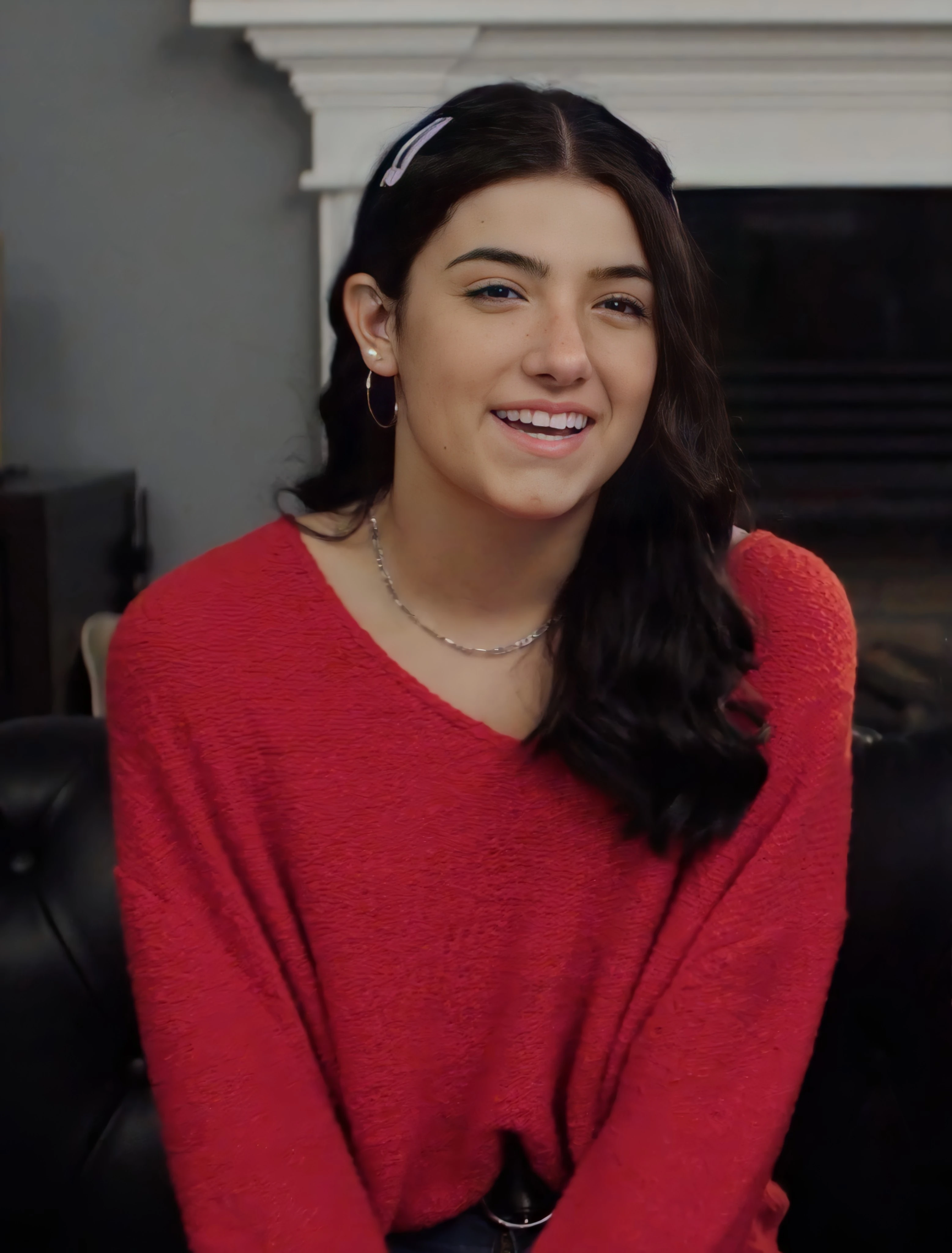 Charli D'Amelio wearing glowing pastel outfits with warm undertones, showcasing peach sorbet, seafoam, buttercream, leafy green, and rose beige from the Soft Spring palette.