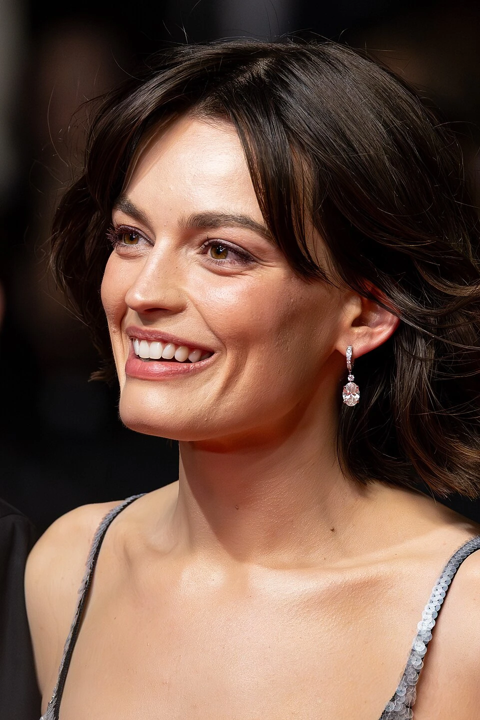 Emma Mackey wearing velvety pastel looks with cool-muted tones, showcasing heather gray, dusty mauve, mist blue, slate green, and antique silver from the Soft Summer palette.