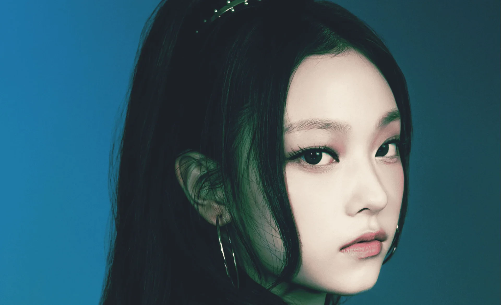 Editorial gallery of Haerin (NewJeans) styled in bright winter looks with electric blues, magenta accents, and polished black, highlighting electric cobalt, icy magenta, optic white, chrome silver, and inky black.