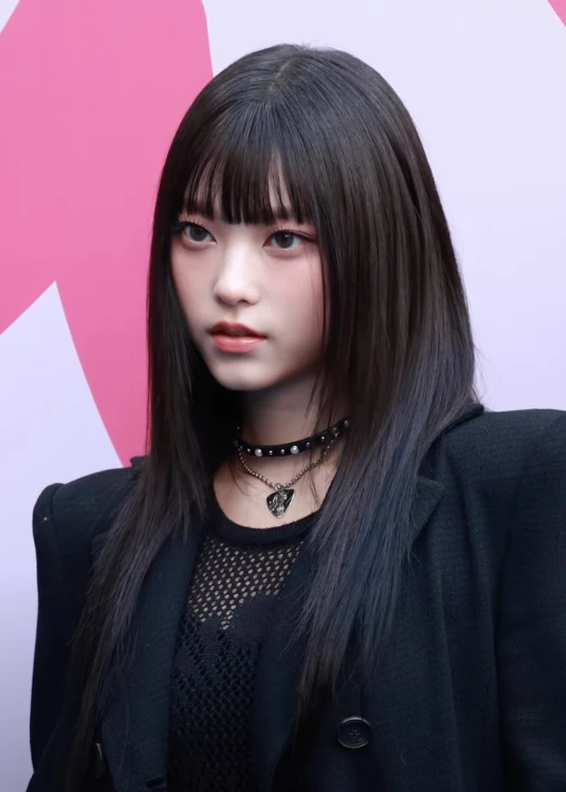 Haerin (NewJeans) wearing jewel-toned statement dressing with crisp contrast and sparkle, showcasing electric cobalt, icy magenta, optic white, chrome silver, and inky black from the Bright Winter palette.