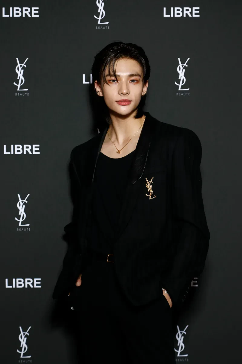 Editorial gallery of Hyunjin (Stray Kids) styled in vibrant autumn outfits featuring saffron, teal, and gold hardware, highlighting burnt sienna, chartreuse, emerald, molten gold, and espresso.