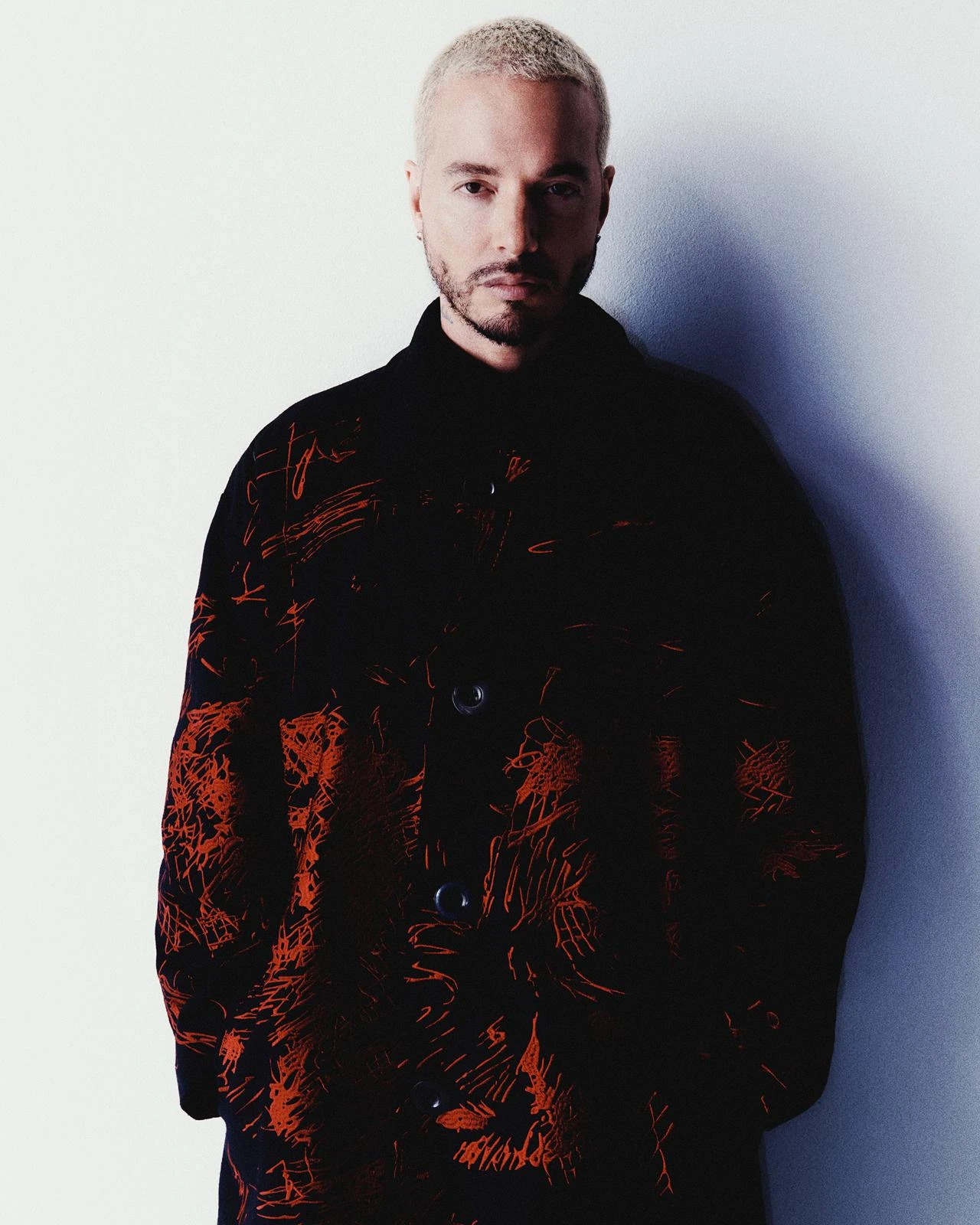 J Balvin wearing high-contrast electric brights paired with sharp tailoring, showcasing ultra violet, neon fuchsia, electric jade, polished pewter, and onyx from the Bold Winter palette.