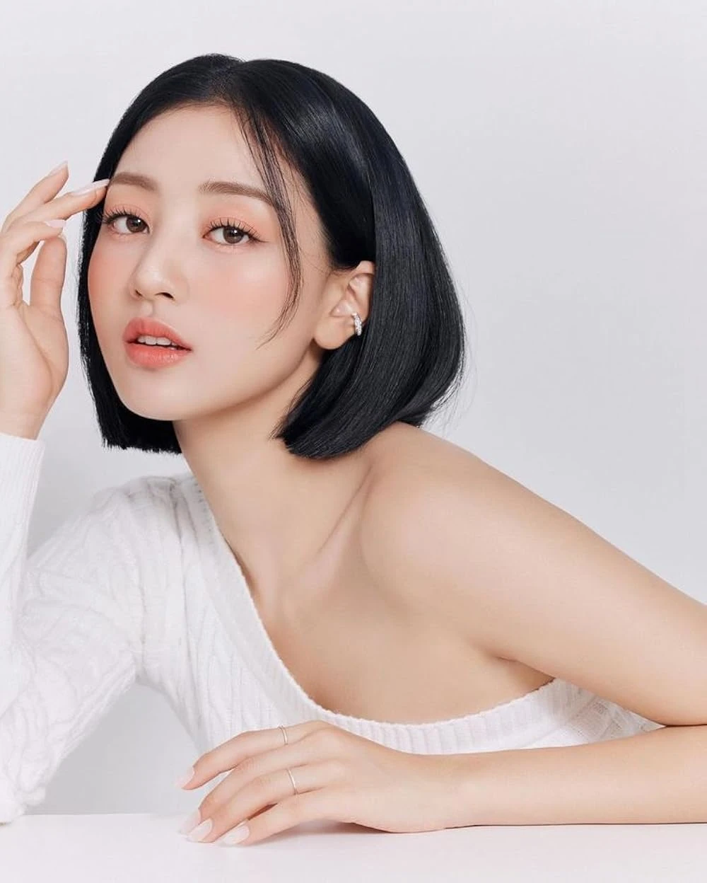 Editorial gallery of Jihyo (TWICE) styled in bright winter looks with electric blues, magenta accents, and polished black, highlighting electric cobalt, icy magenta, optic white, chrome silver, and inky black.