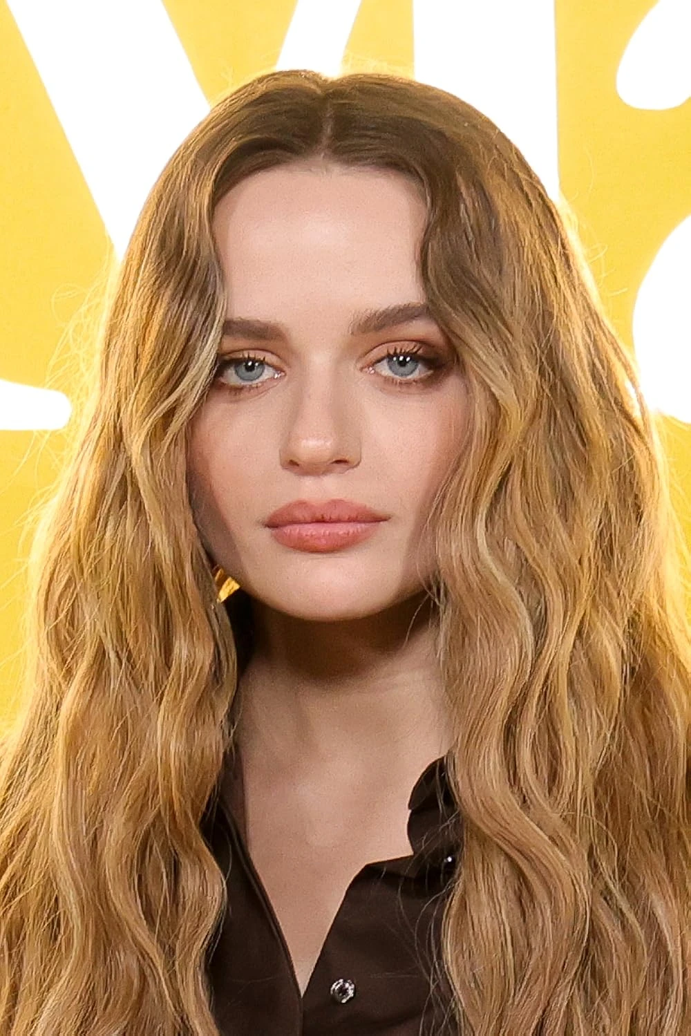 Joey King wearing saturated autumn looks with molten metallics, showcasing burnt sienna, chartreuse, emerald, molten gold, and espresso from the Vibrant Autumn palette.