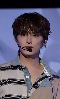 Jun (SEVENTEEN) wearing deep jewel-toned ensembles with sharp contrast, showcasing midnight navy, crimson, amethyst, gunmetal, and snow white from the Deep Winter palette.