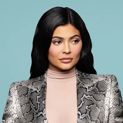 Editorial gallery of Kylie Jenner styled in neutral winter outfits highlighting sapphire, burgundy, and smoked grays, highlighting onyx, graphite, powder pink, optic white, and silver chrome.