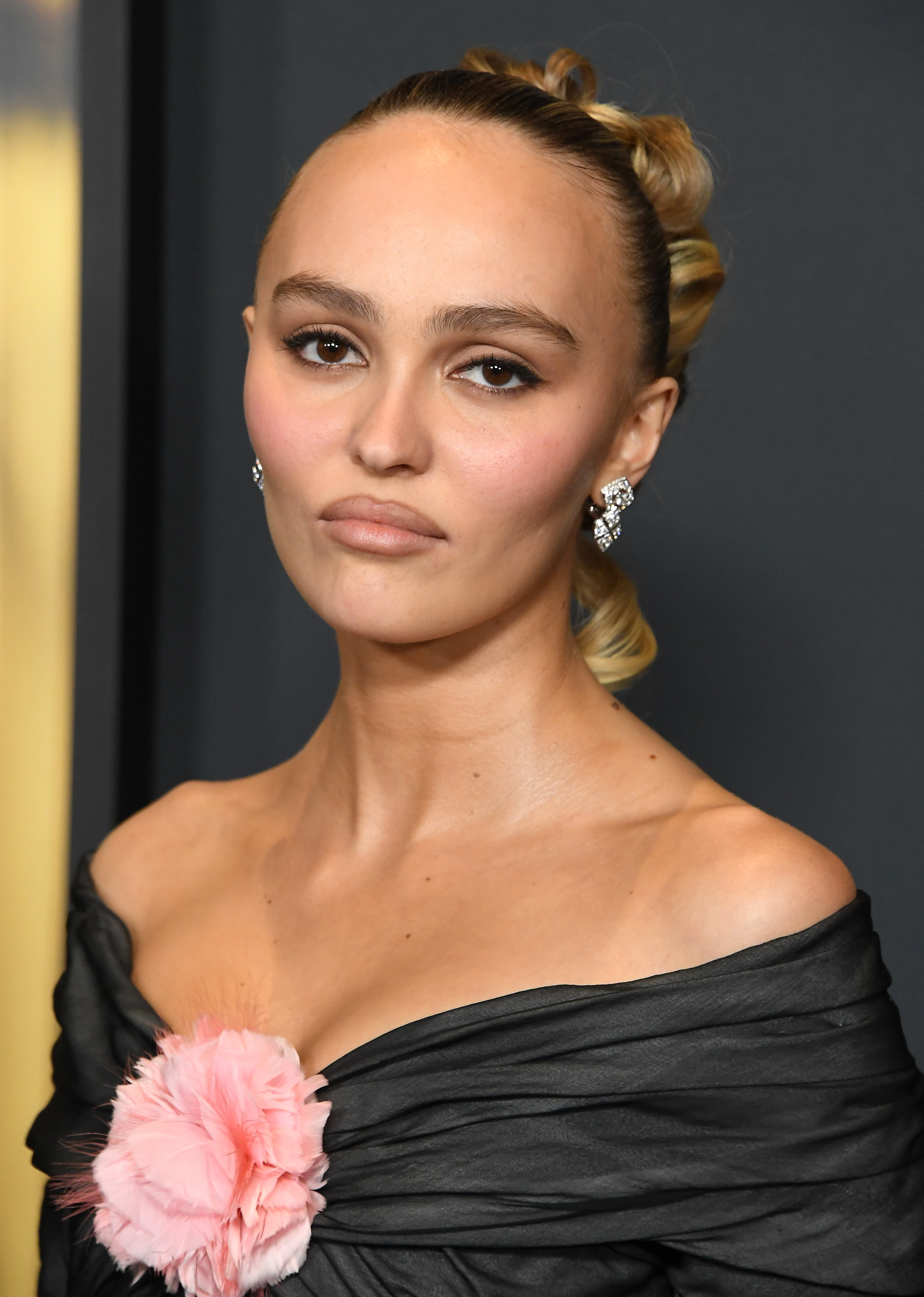 Lily-Rose Depp wearing velvety pastel looks with cool-muted tones, showcasing powder pink, dusty lilac, mist gray, soft navy, and rose beige from the Soft Summer palette.