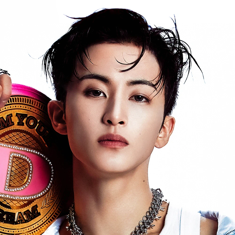 Editorial gallery of Mark (NCT) styled in bold winter ensembles mixing neon pops, inky black, and chrome sparkle, highlighting ultra violet, neon fuchsia, electric jade, polished pewter, and onyx.