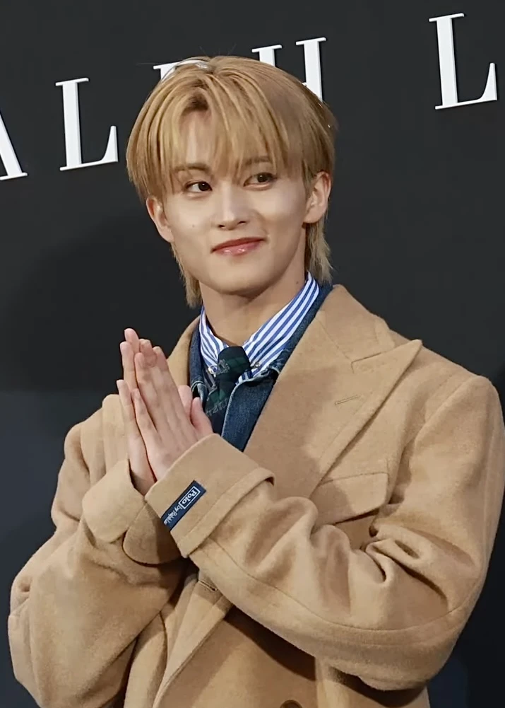 Mark (NCT) wearing high-contrast electric brights paired with sharp tailoring, showcasing ultra violet, neon fuchsia, electric jade, polished pewter, and onyx from the Bold Winter palette.