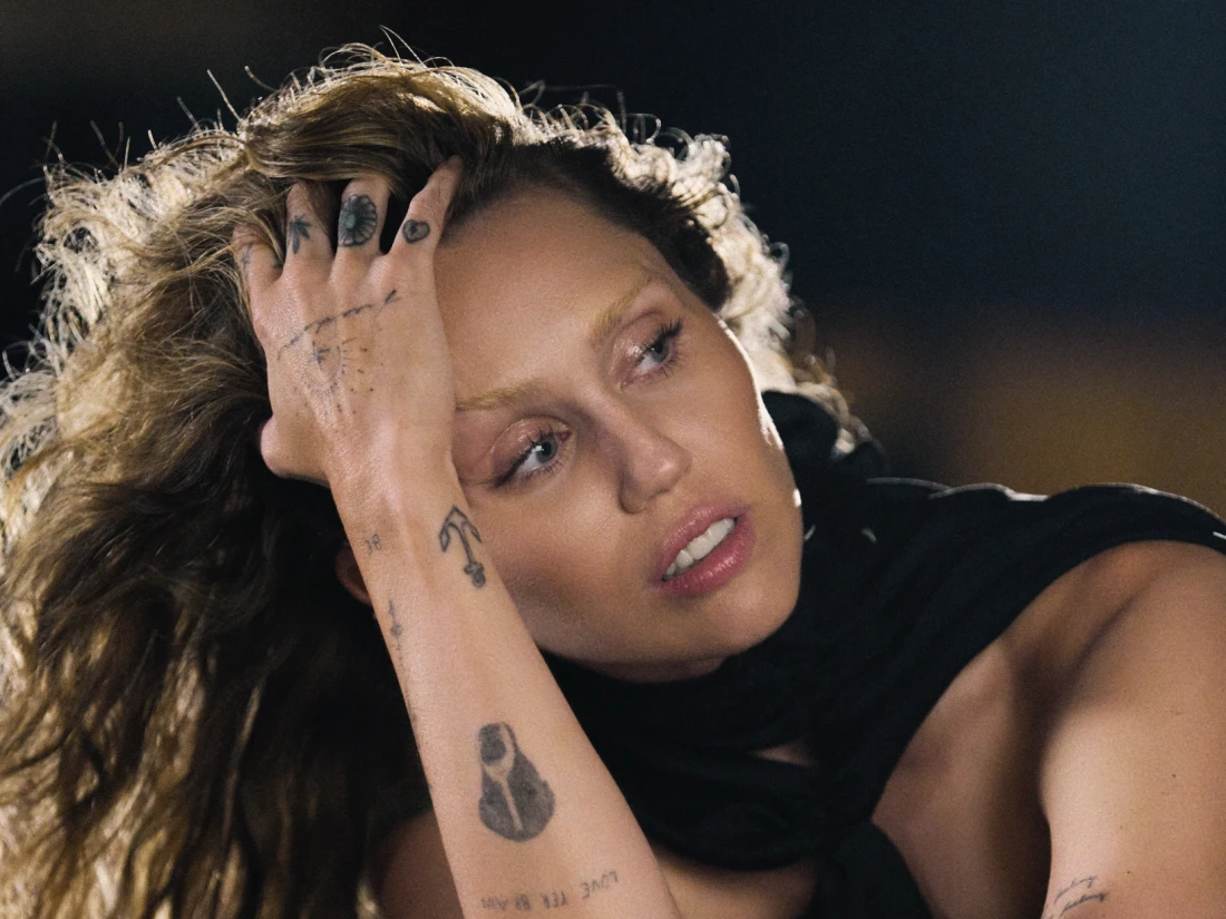 Editorial gallery of Miley Cyrus styled in vibrant autumn outfits featuring saffron, teal, and gold hardware, highlighting molten gold, burnt orange, emerald, leopard, and ruby.