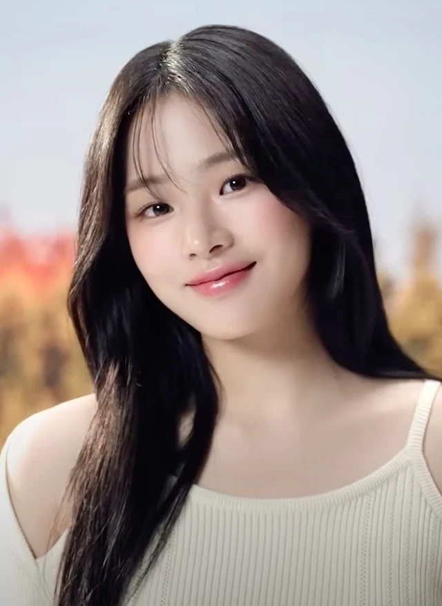 Minji (NewJeans) wearing velvety pastel looks with cool-muted tones, showcasing baby blue, lavender, mist gray, soft navy, and peachy pink from the Soft Summer palette.