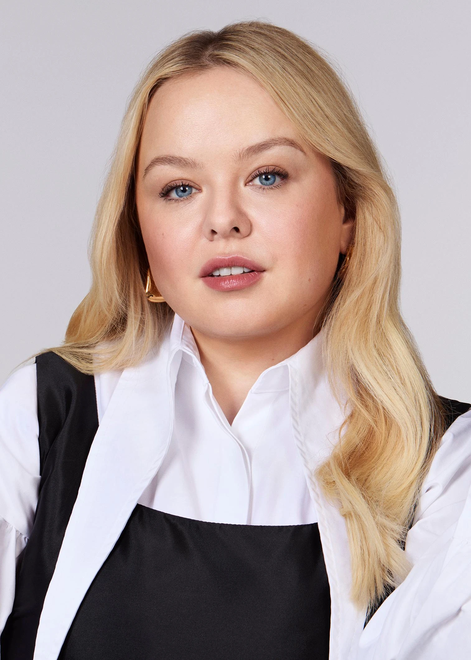 Nicola Coughlan wearing cool-toned looks with berry accents and fluid movement, showcasing powder blue, soft lilac, rose quartz, silvery sage, and midnight plum from the True Summer palette.