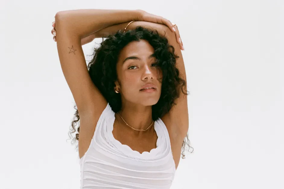 Editorial gallery of Olivia Dean styled in soft summer outfits blending dusty mauve, mist blue, and slate neutrals, highlighting heather gray, dusty mauve, mist blue, slate green, and antique silver.