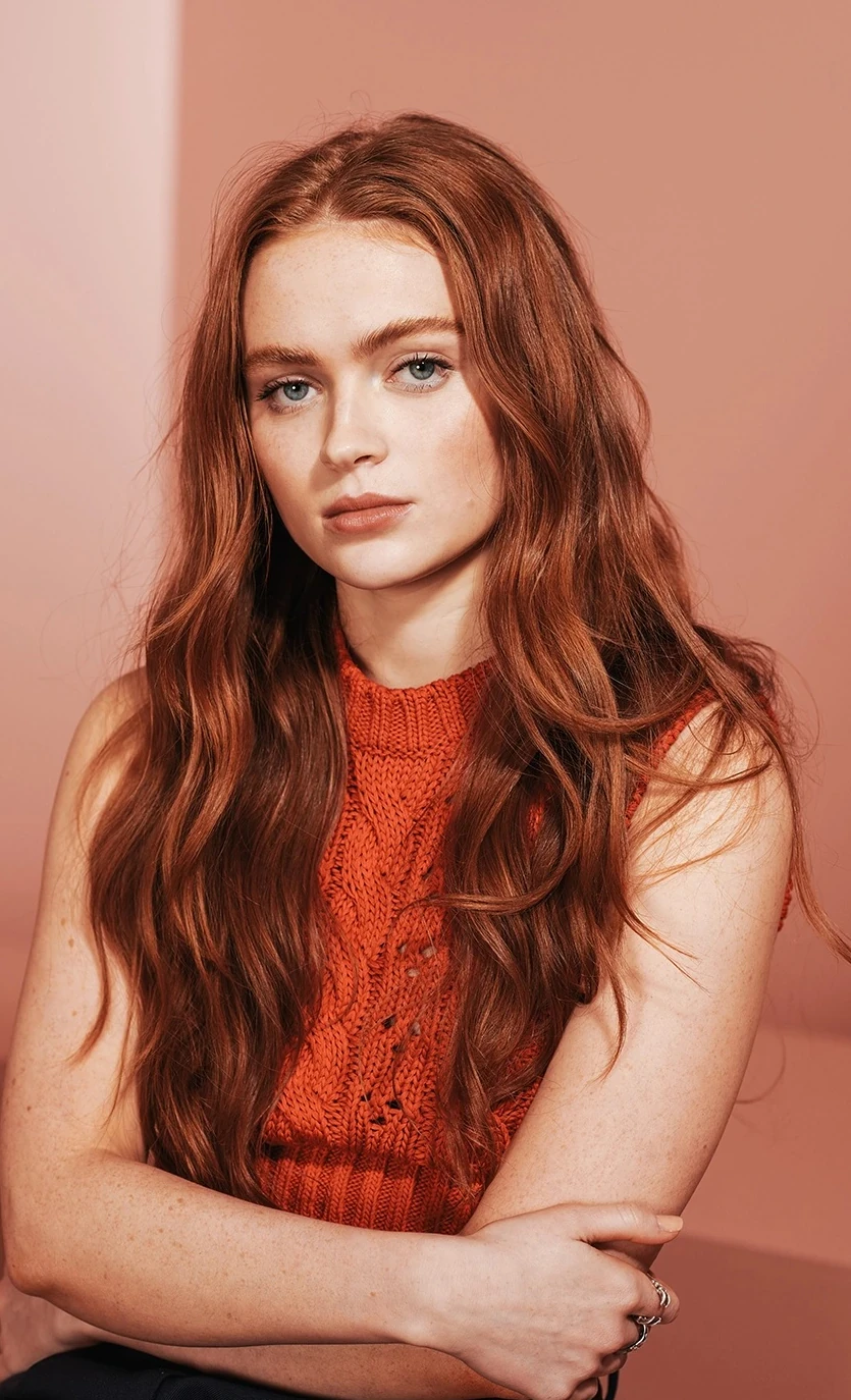 Editorial gallery of Sadie Sink styled in vibrant autumn outfits featuring saffron, teal, and gold hardware, highlighting tangerine, teal, copper, brick red, and warm ivory.