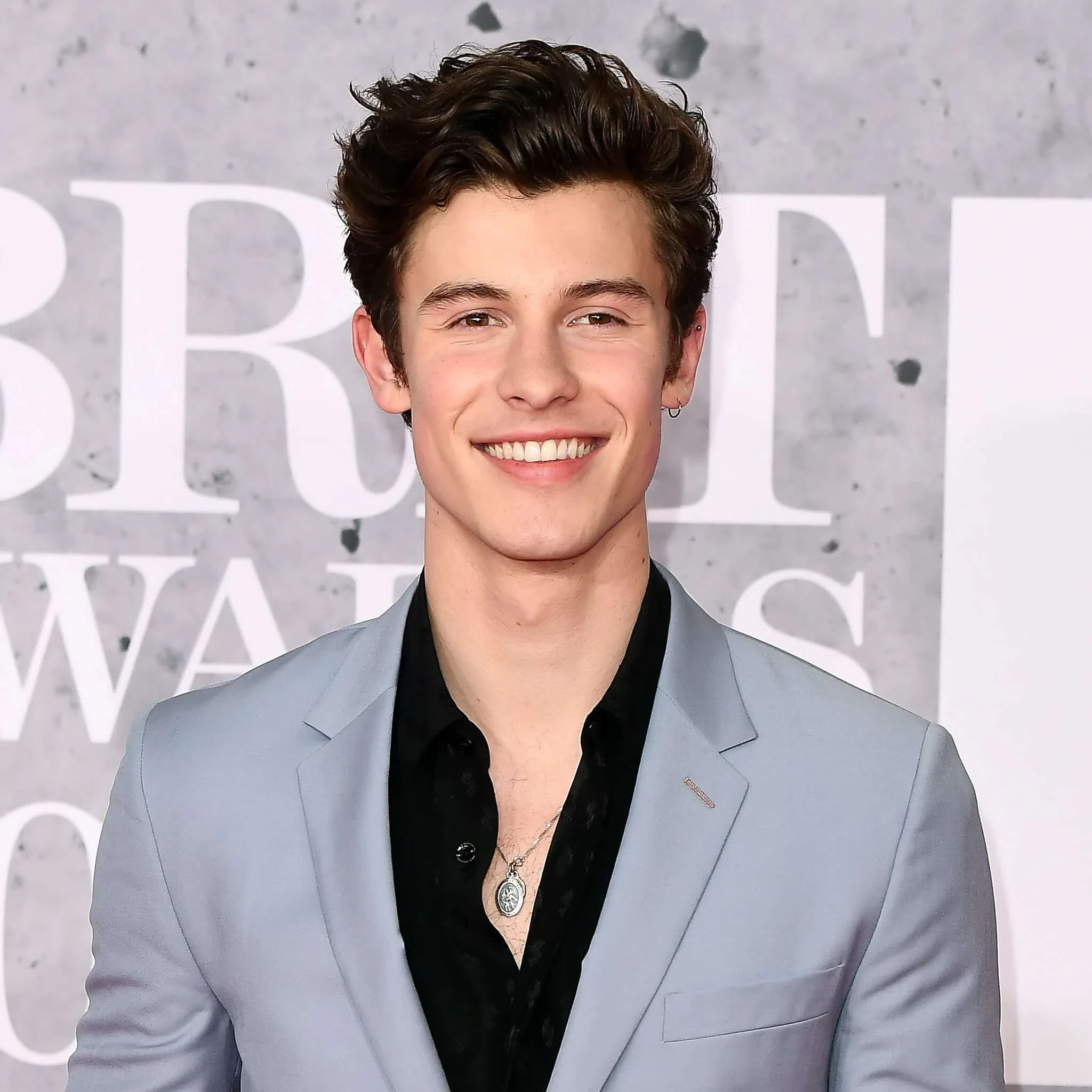 Editorial gallery of Shawn Mendes styled in light summer outfits blending powder blues, lilac, and silvery neutrals, highlighting sky blue, cool blush, opal gray, mint chiffon, and soft navy.