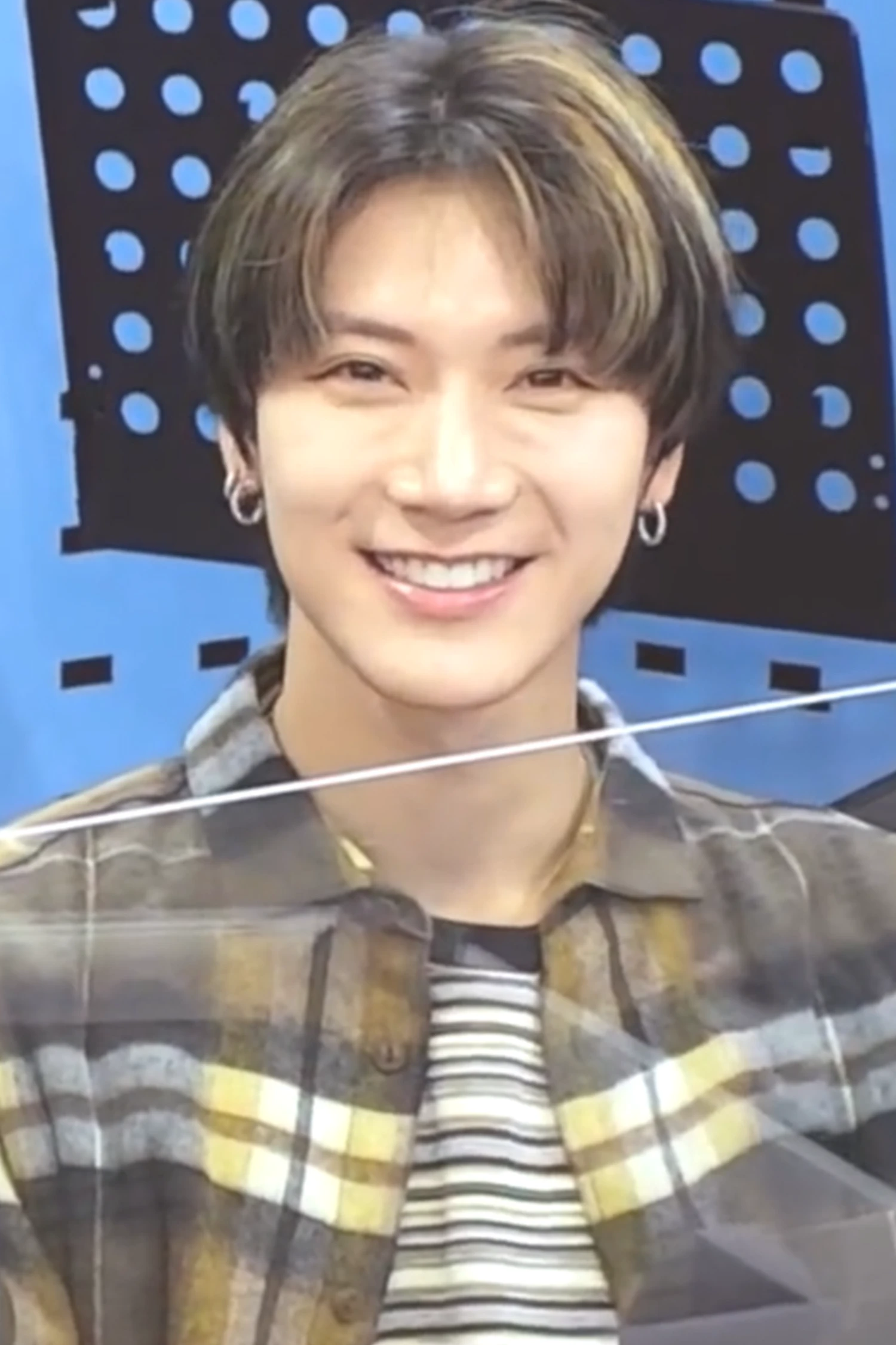 Ten (NCT) wearing high-contrast electric brights paired with sharp tailoring, showcasing ultra violet, neon fuchsia, electric jade, polished pewter, and onyx from the Bold Winter palette.